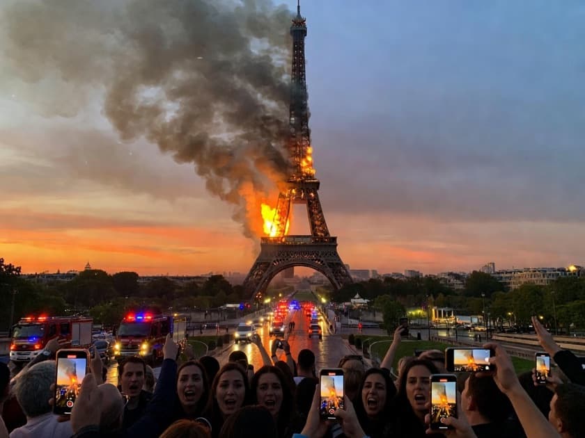 An AI-generated news-style photo of the Eiffel Tower on fire at dusk while crowds film it
